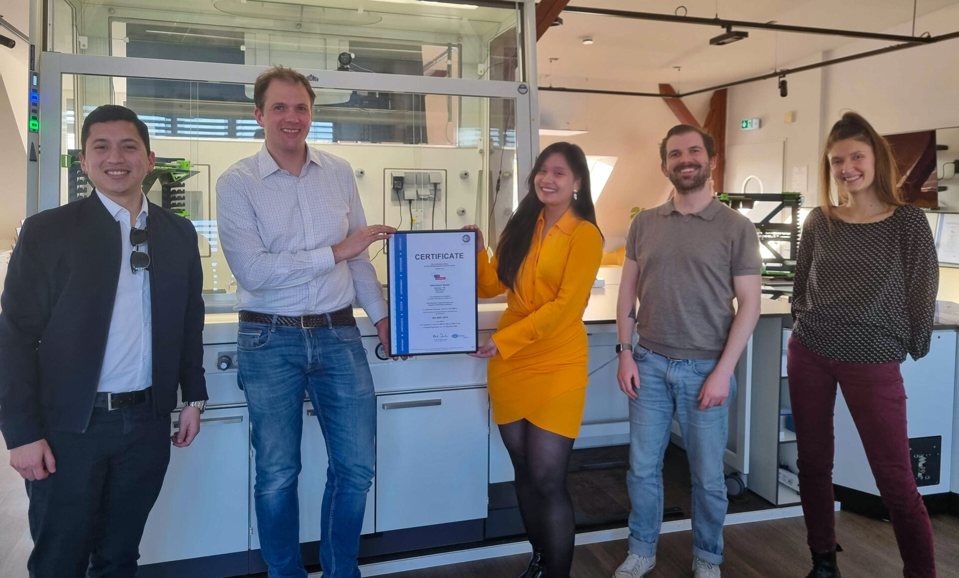Team photo with ISO cert